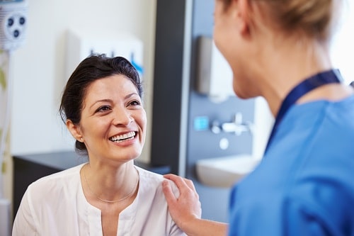 Woman smiling appointment stock photo