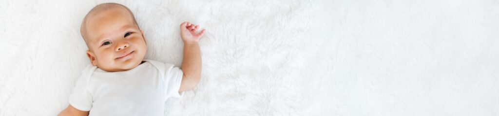 portrait newborn baby happy over white background topview.jpg s1024x1024wisk20crB6R 7Br9jykWx7MlJMUlm Ig1UhPGj01Yl12FVBCV4